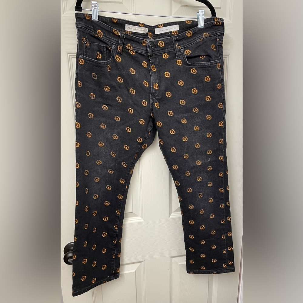 Anthropologie Pilcro Black Cropped Jeans with Orange, flower detail. Size 33